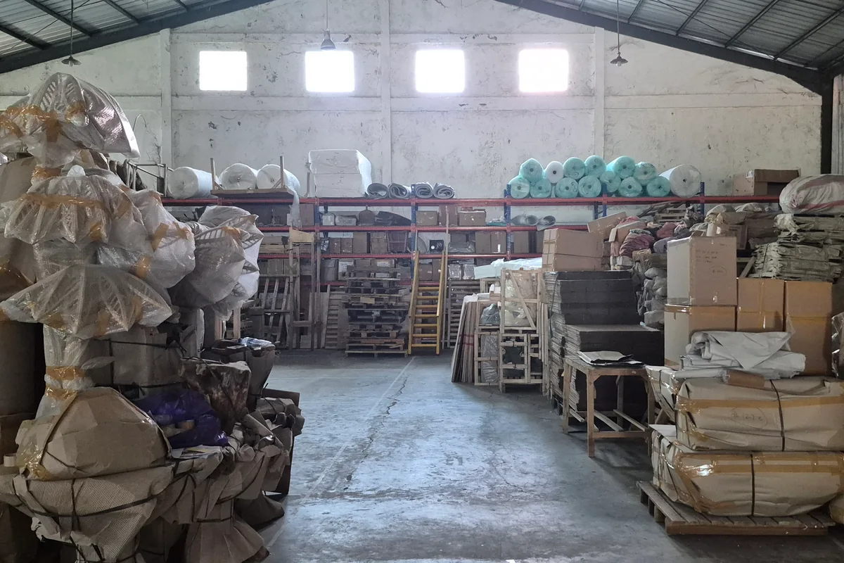 Furniture wrapped and packed for sea freight in a Bali warehouse