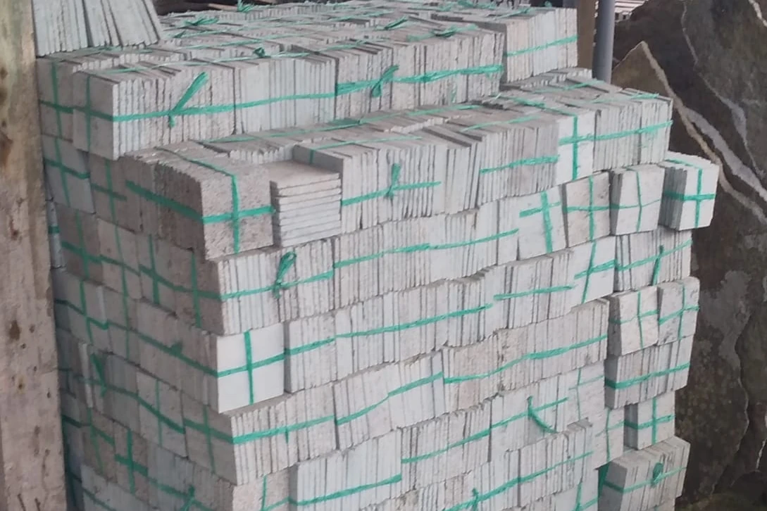 Pallet of strapped natural stone tiles, export-ready in Bali