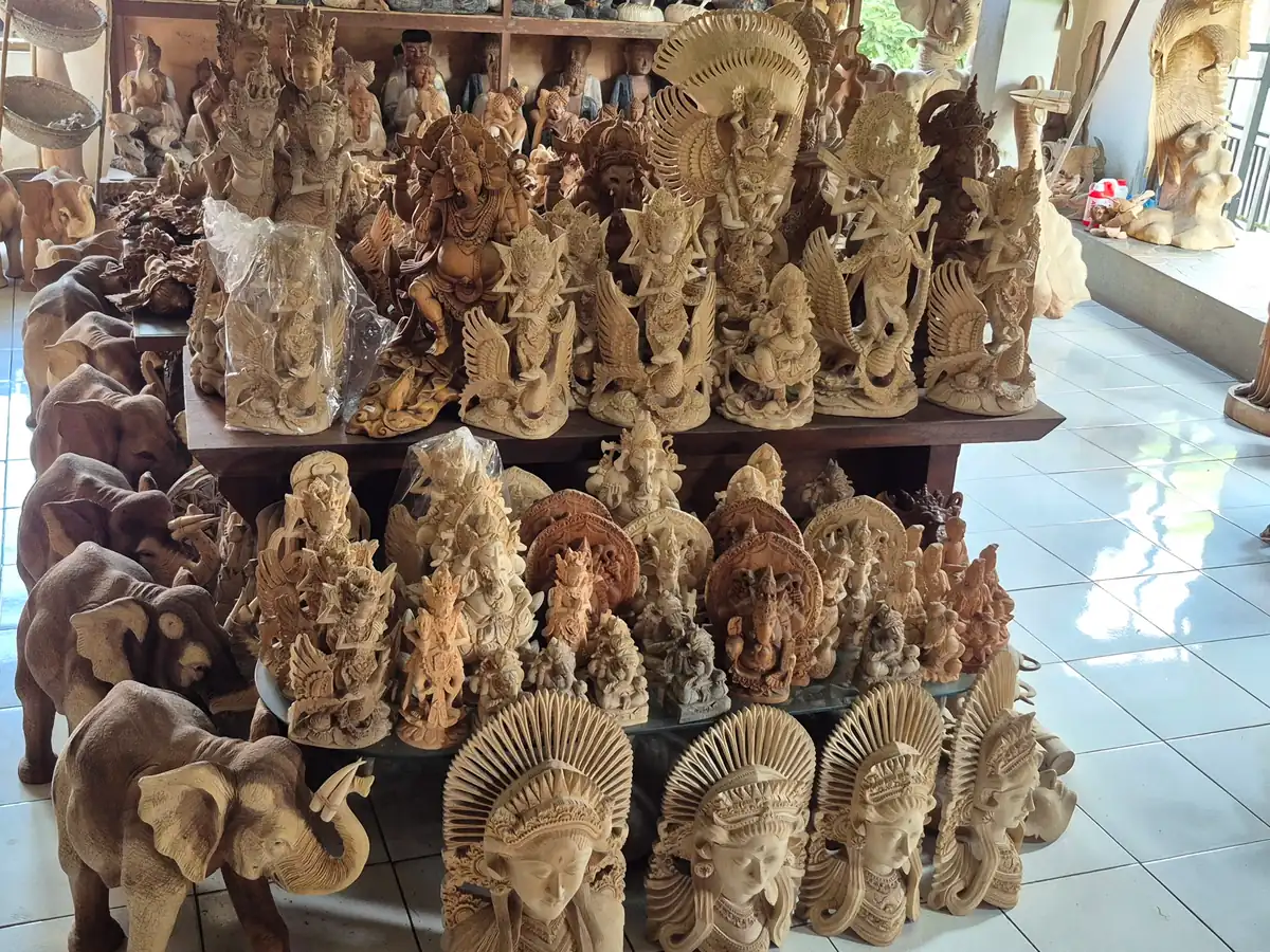 Balinese wood carvings on display at a carving supplier, sourced by ExportBali