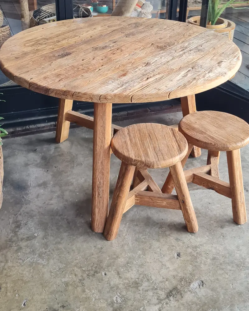 Round reclaimed wood table with two stools from a Bali supplier