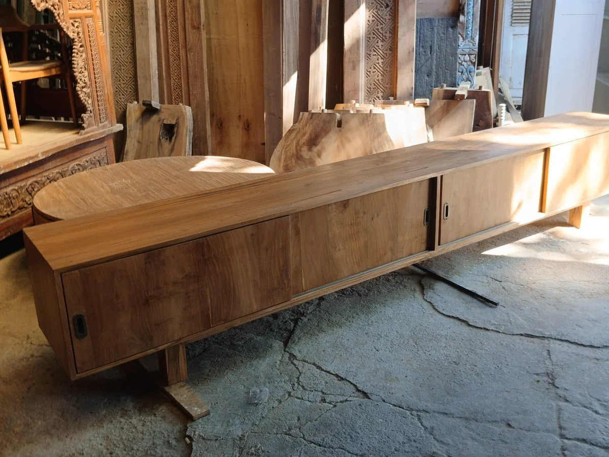 Long teak sideboard cabinet in a Bali furniture showroom, sourced by ExportBali